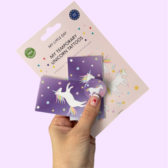 Unicorn badge, notebooks and tattoos
