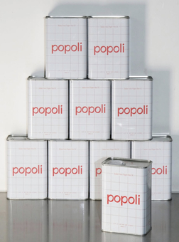 pile of Popoli Italian extra virgin olive oil in tin cans