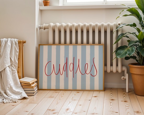 Kids bedroom wall art with blue and white stripes and handwritten text ‘cuddles’