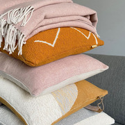 Misty pink recycled wool throws and cushions