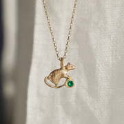 Gold rat and emerald necklace