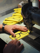 Making leather sunglasses cases sewing them up 