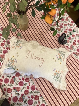 Hand embroidered bespoke rainbow cushion striped with drill ruffle trim. Boys name stars cushion, girls room, gift ideas children’s nursery 