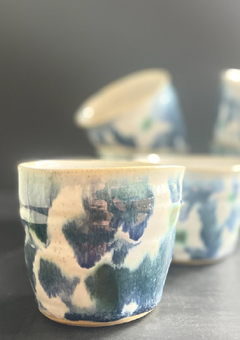 Coffee tumbler cups with abstract floral blue glaze pattern