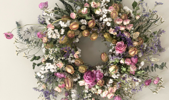 Wild dried flower wreath in shades of pink, white and green