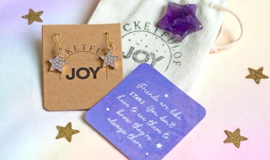 a joyful gift set containing a pair of star earrings and an amethyst healing crystal with a friendship sentimental message