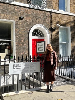 book lover stood in front of the charles dickens house in london